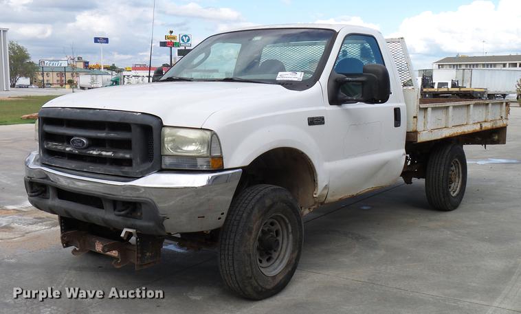 image for item DD5941 2003 Ford F250 Super Duty flatbed pickup truck