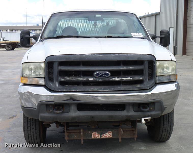 image for item DD5941 2003 Ford F250 Super Duty flatbed pickup truck