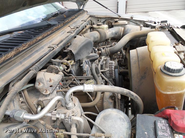 image for item DD5941 2003 Ford F250 Super Duty flatbed pickup truck