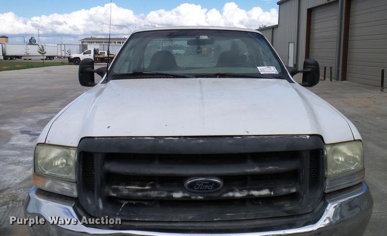 image for item DD5941 2003 Ford F250 Super Duty flatbed pickup truck