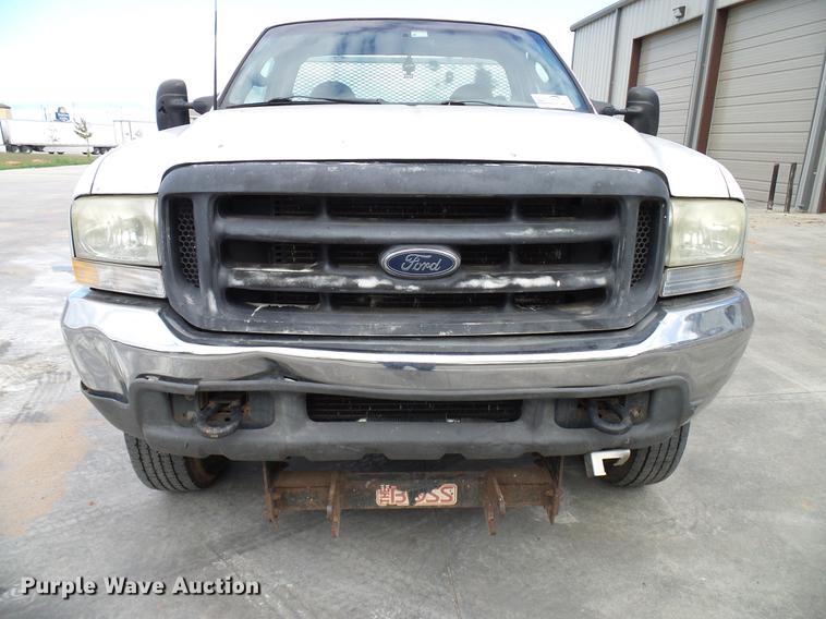 image for item DD5941 2003 Ford F250 Super Duty flatbed pickup truck