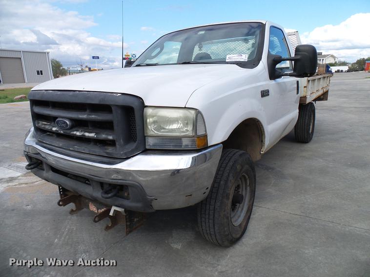 image for item DD5941 2003 Ford F250 Super Duty flatbed pickup truck