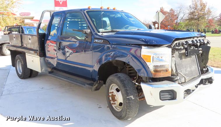 image for item DF1288 2011 Ford F350 Super Duty SuperCab flatbed pickup truck