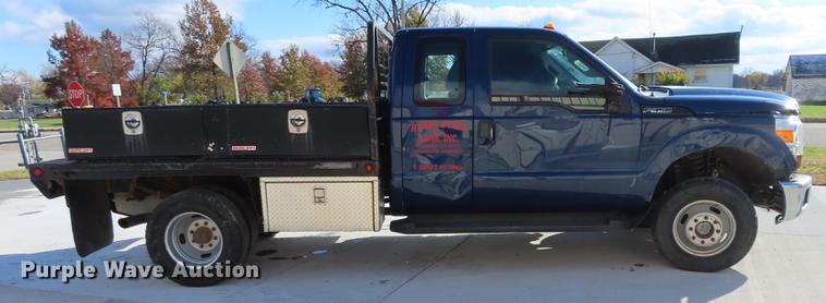 image for item DF1288 2011 Ford F350 Super Duty SuperCab flatbed pickup truck