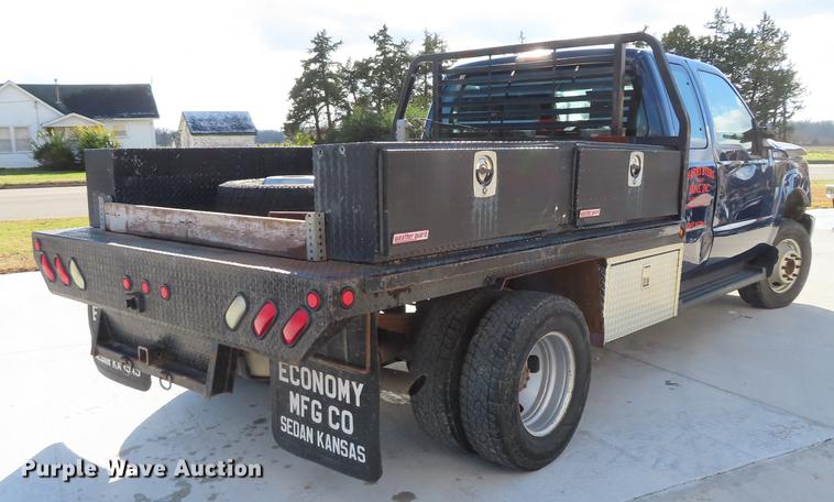 image for item DF1288 2011 Ford F350 Super Duty SuperCab flatbed pickup truck