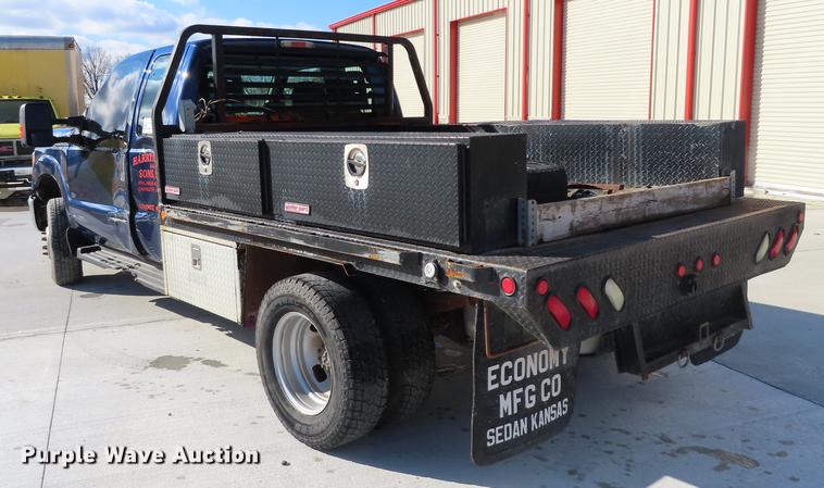 image for item DF1288 2011 Ford F350 Super Duty SuperCab flatbed pickup truck