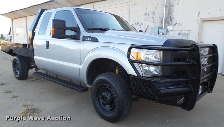 image for item EN9656 2013 Ford F350 Super Duty SuperCab flatbed pickup truck