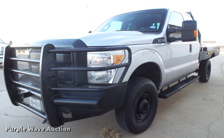 image for item EN9656 2013 Ford F350 Super Duty SuperCab flatbed pickup truck
