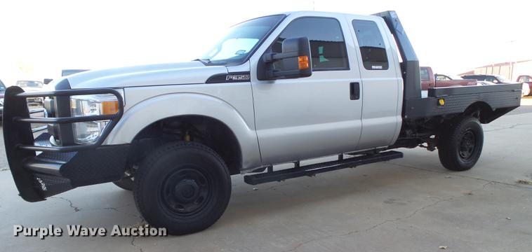 image for item EN9656 2013 Ford F350 Super Duty SuperCab flatbed pickup truck