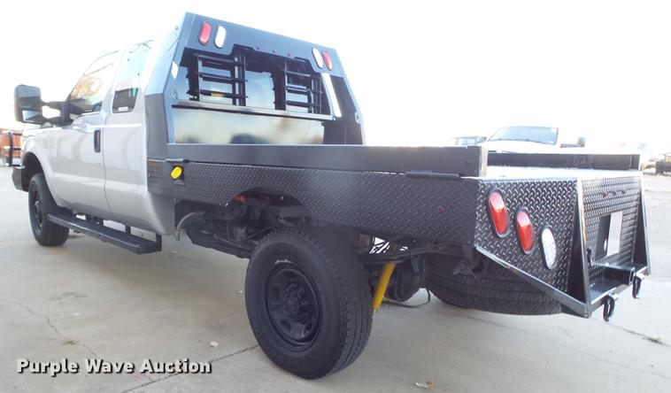 image for item EN9656 2013 Ford F350 Super Duty SuperCab flatbed pickup truck