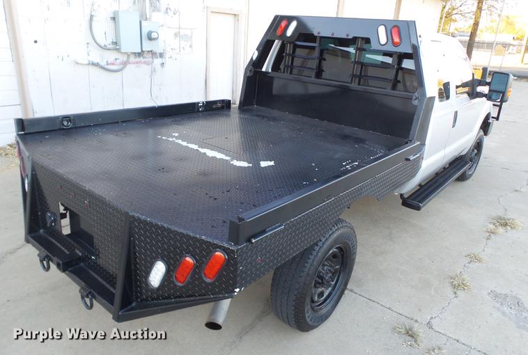 image for item EN9656 2013 Ford F350 Super Duty SuperCab flatbed pickup truck
