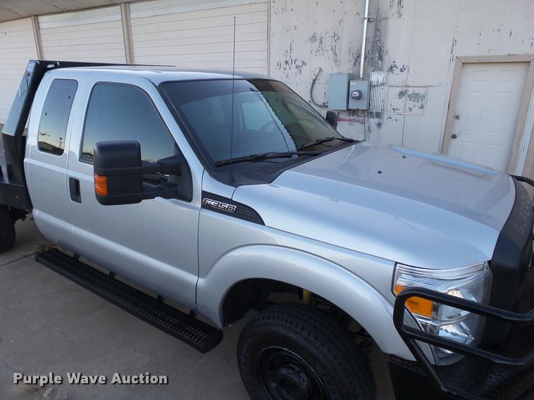 image for item EN9656 2013 Ford F350 Super Duty SuperCab flatbed pickup truck