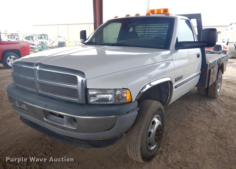 image for item EW9531 2002 Dodge Ram 3500 Laramie SLT flatbed pickup truck