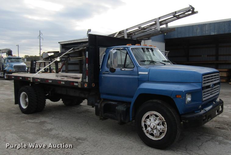 image for item DE5888 1995 Ford F700 flat dump bed truck