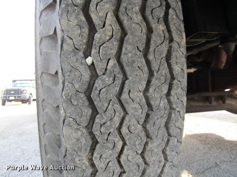 image for item DE5888 1995 Ford F700 flat dump bed truck