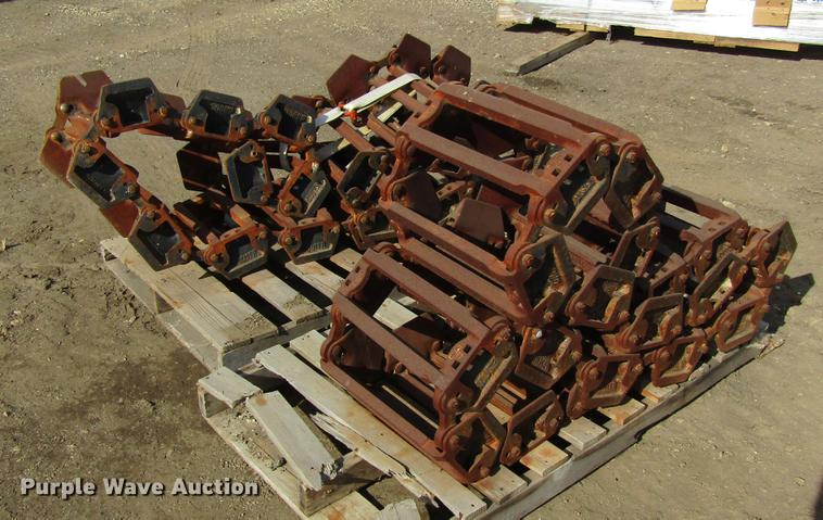 image for item EU9522 Grouser skid steer over tire tracks