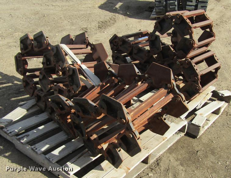 image for item EU9522 Grouser skid steer over tire tracks