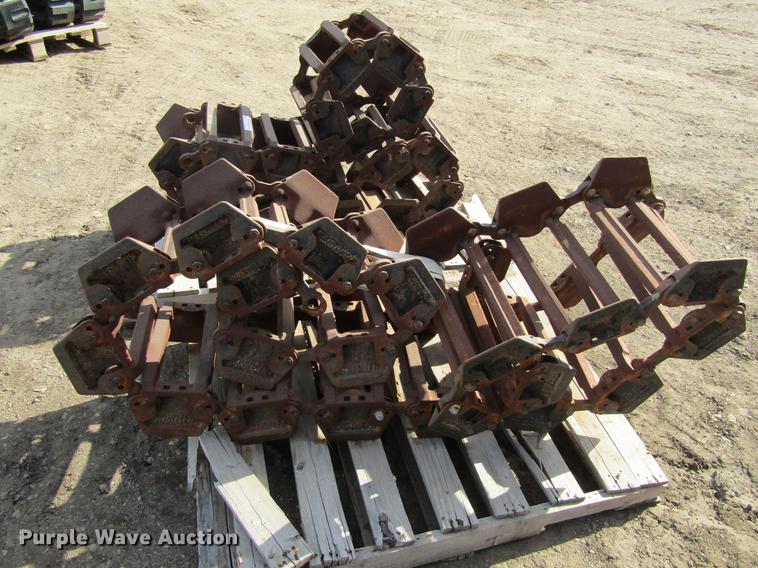 image for item EU9522 Grouser skid steer over tire tracks