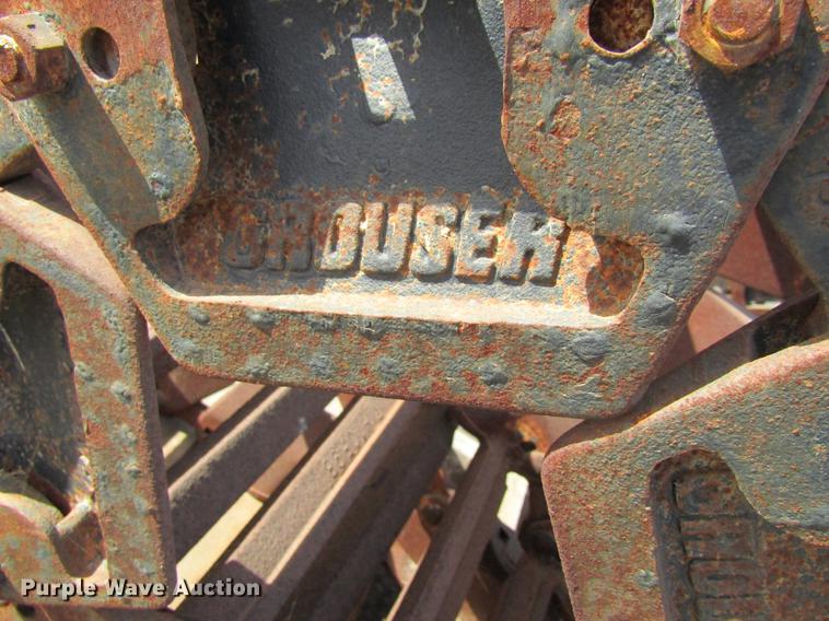 image for item EU9522 Grouser skid steer over tire tracks