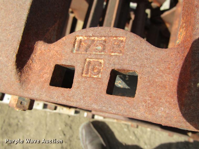 image for item EU9522 Grouser skid steer over tire tracks