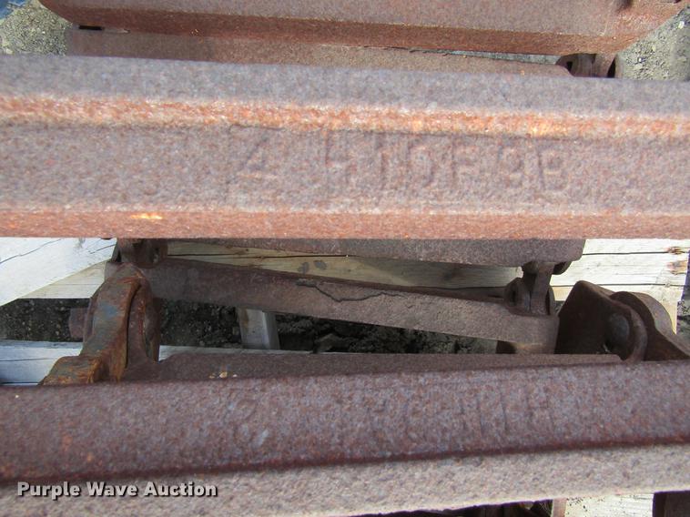 image for item EU9522 Grouser skid steer over tire tracks