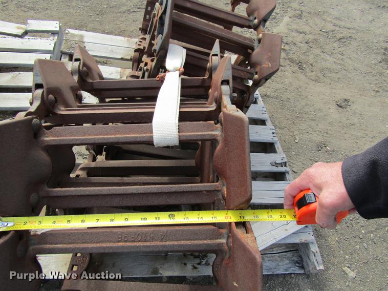 image for item EU9522 Grouser skid steer over tire tracks