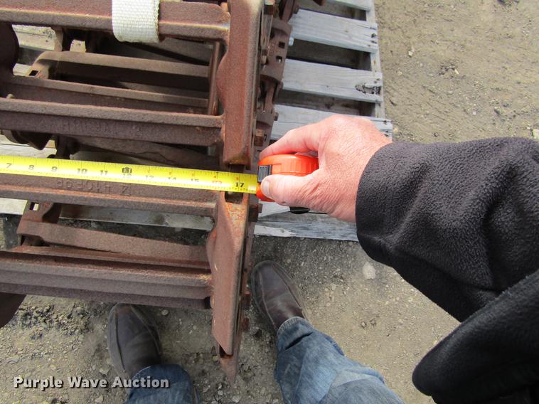 image for item EU9522 Grouser skid steer over tire tracks