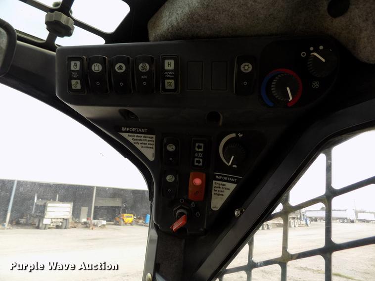 image for item DB9033 2012 John Deere 328D skid steer