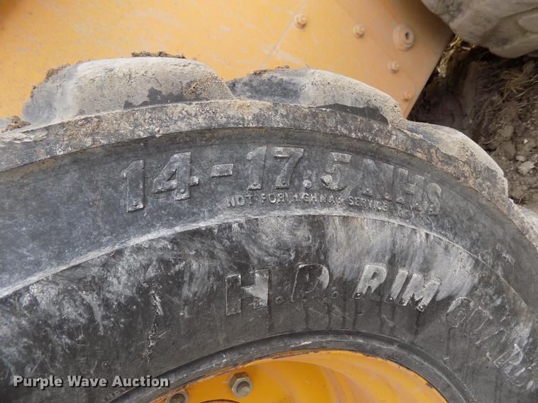 image for item DB9033 2012 John Deere 328D skid steer