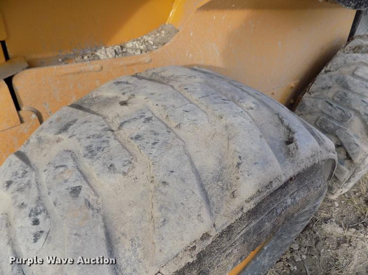 image for item DB9033 2012 John Deere 328D skid steer