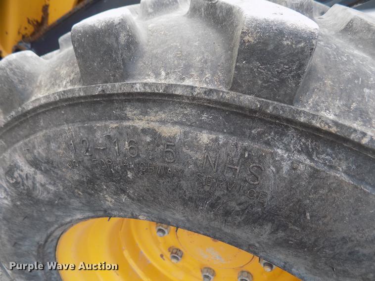 image for item DB9034 2010 John Deere 326D skid steer