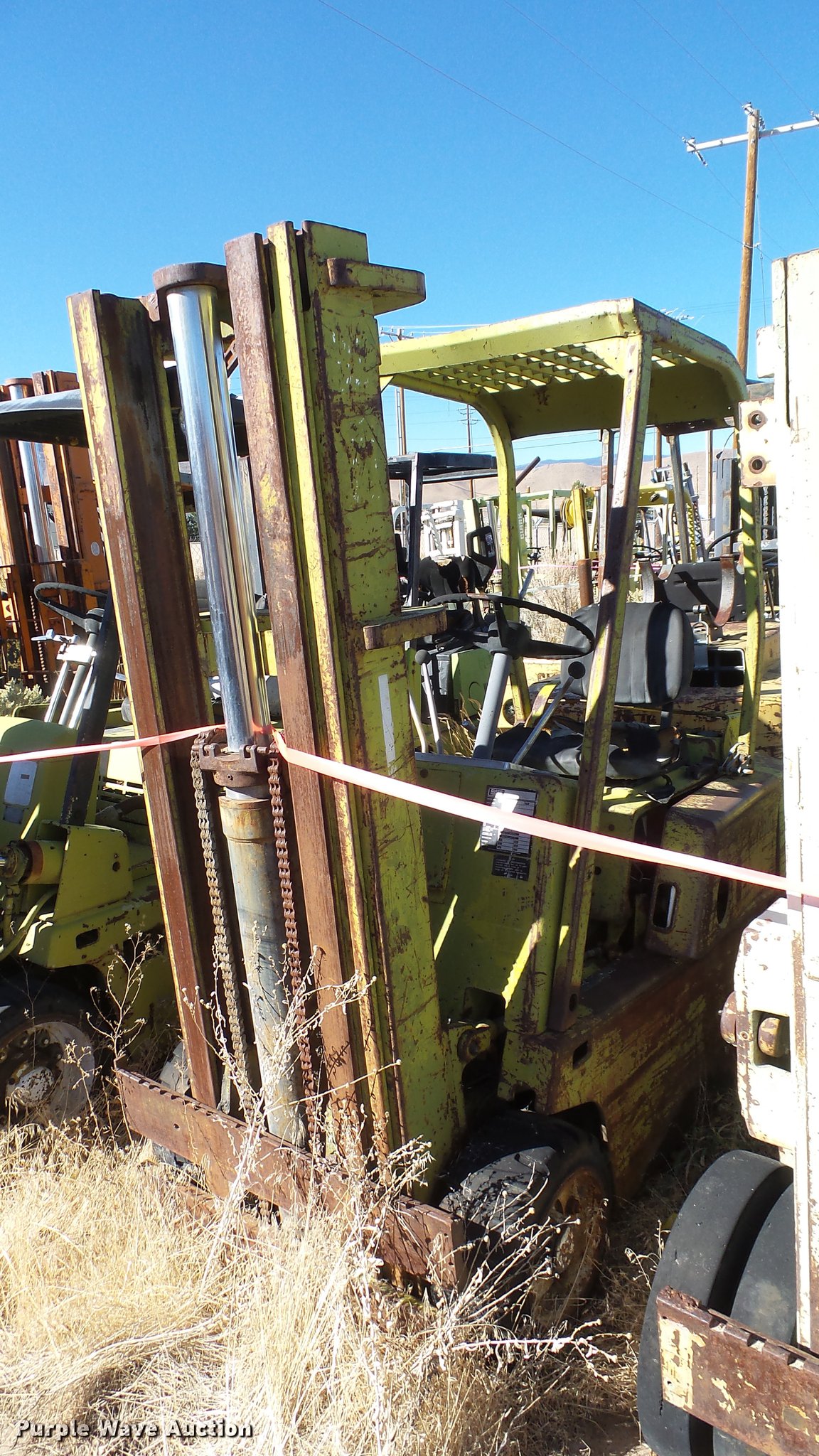 (5) Clark salvage forklifts in Reno, NV Item FS9790 sold Purple Wave
