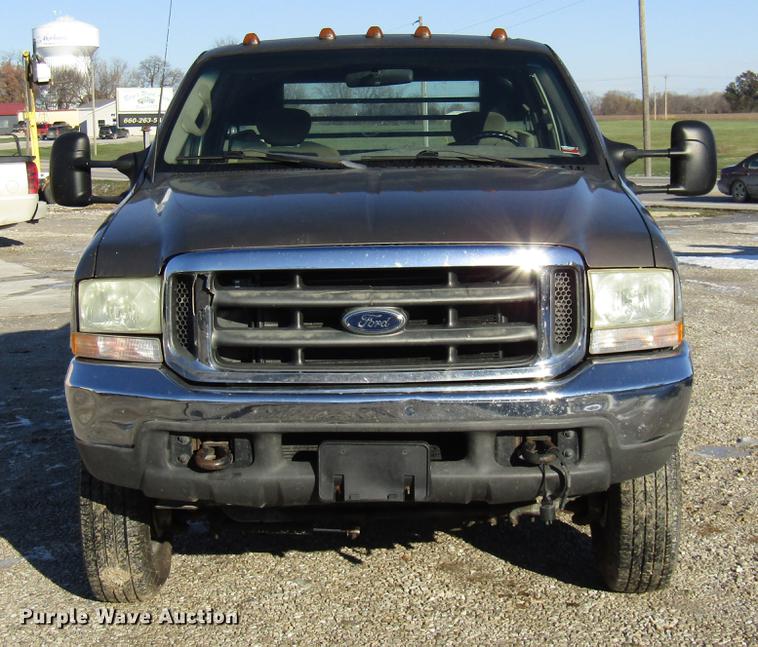 image for item DE5925 2002 Ford F350 Super Duty SuperCab flatbed pickup truck