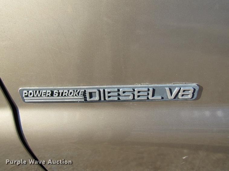 image for item DE5925 2002 Ford F350 Super Duty SuperCab flatbed pickup truck