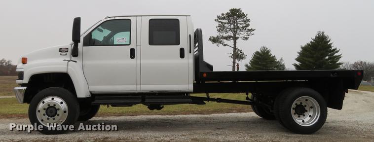 image for item DE5067 2005 GMC C5500 Crew Cab flatbed truck