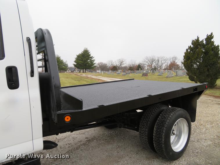 image for item DE5067 2005 GMC C5500 Crew Cab flatbed truck