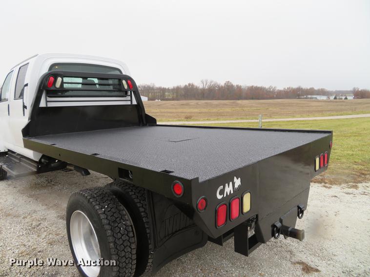 image for item DE5067 2005 GMC C5500 Crew Cab flatbed truck