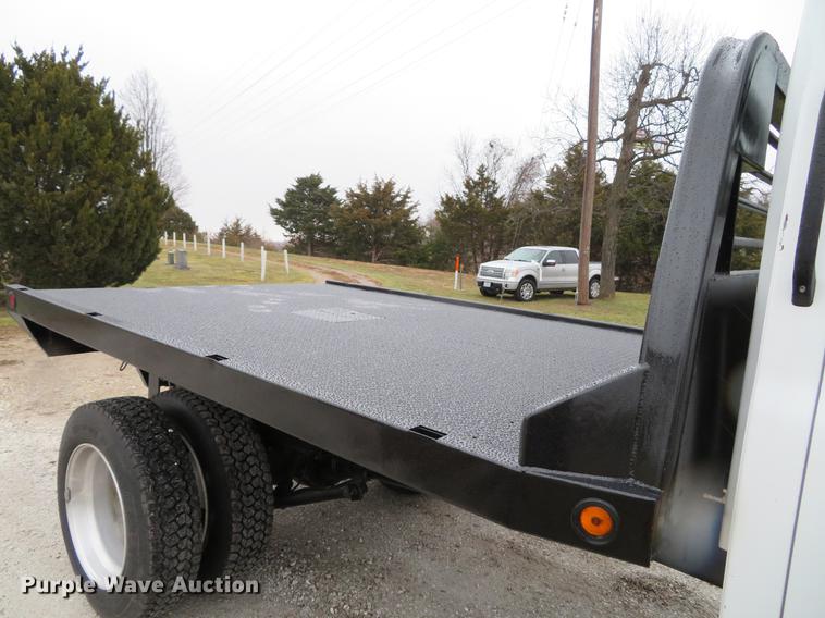 image for item DE5067 2005 GMC C5500 Crew Cab flatbed truck
