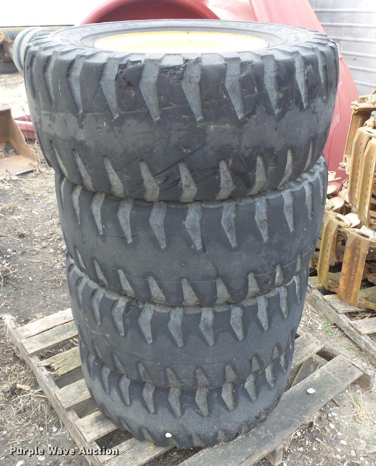 image for item EM9011 (4) Michelin 12R16.5 skid steer tires and wheels