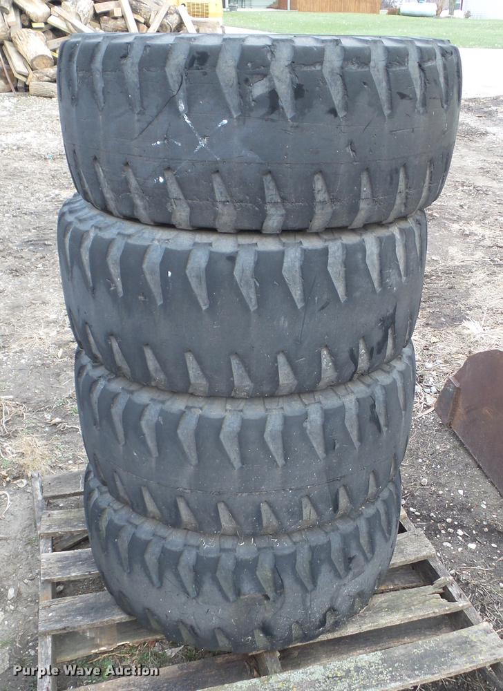 image for item EM9011 (4) Michelin 12R16.5 skid steer tires and wheels