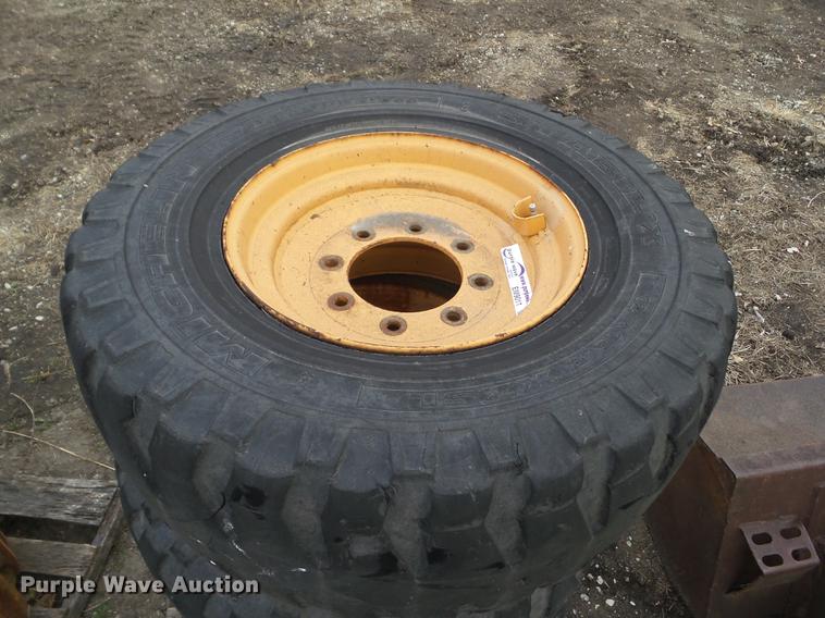 image for item EM9011 (4) Michelin 12R16.5 skid steer tires and wheels