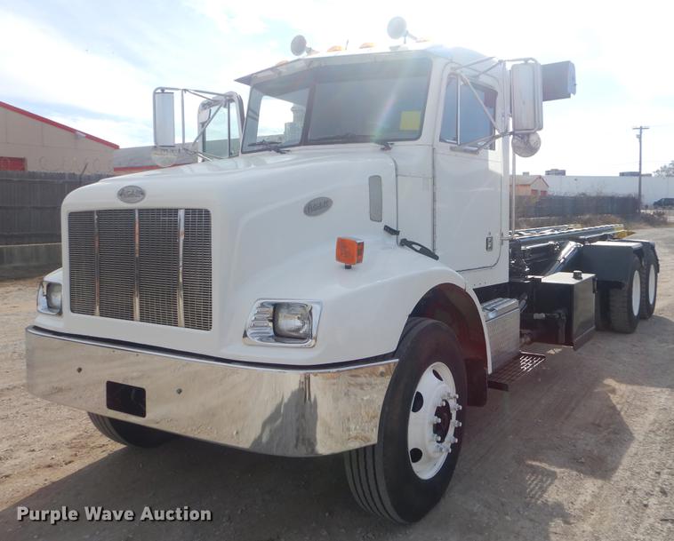 image for item EW9731 1999 Peterbilt 330 roll-off container truck