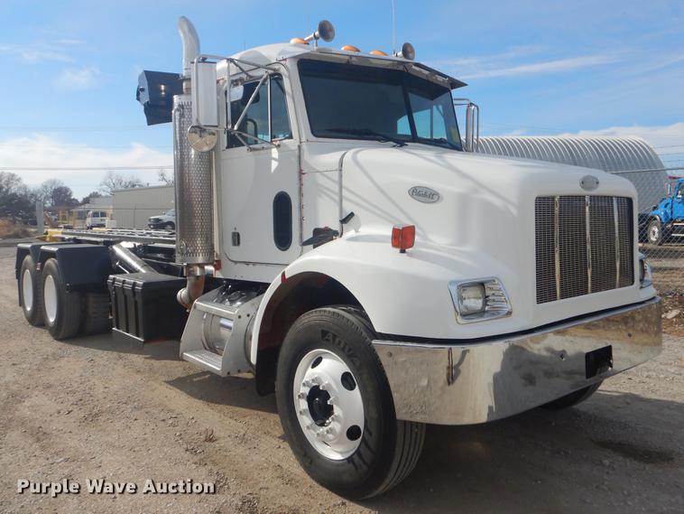 image for item EW9731 1999 Peterbilt 330 roll-off container truck