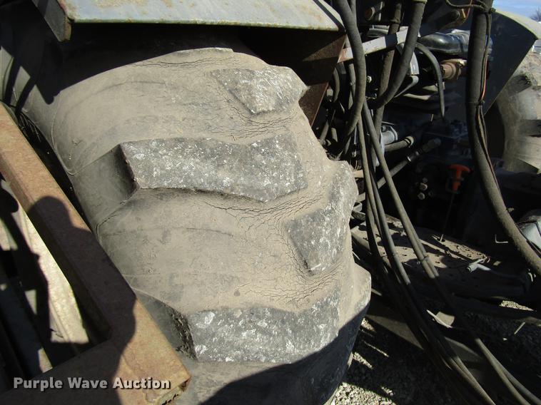 image for item DD3875 Ford 3930 tractor with Texas sod harvester