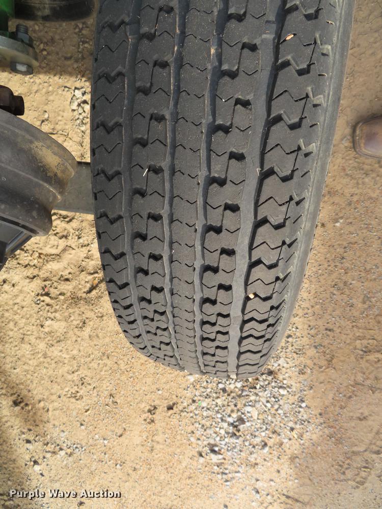 image for item DF1313 1998 John Deere 930 flex head and trailer