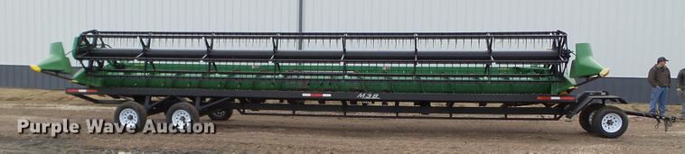 image for item DX9728 2011 John Deere 635F flex head and trailer