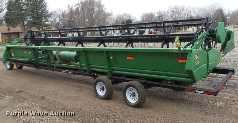 image for item DX9728 2011 John Deere 635F flex head and trailer