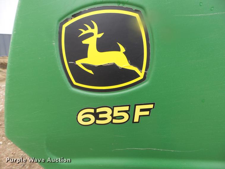 image for item DX9728 2011 John Deere 635F flex head and trailer