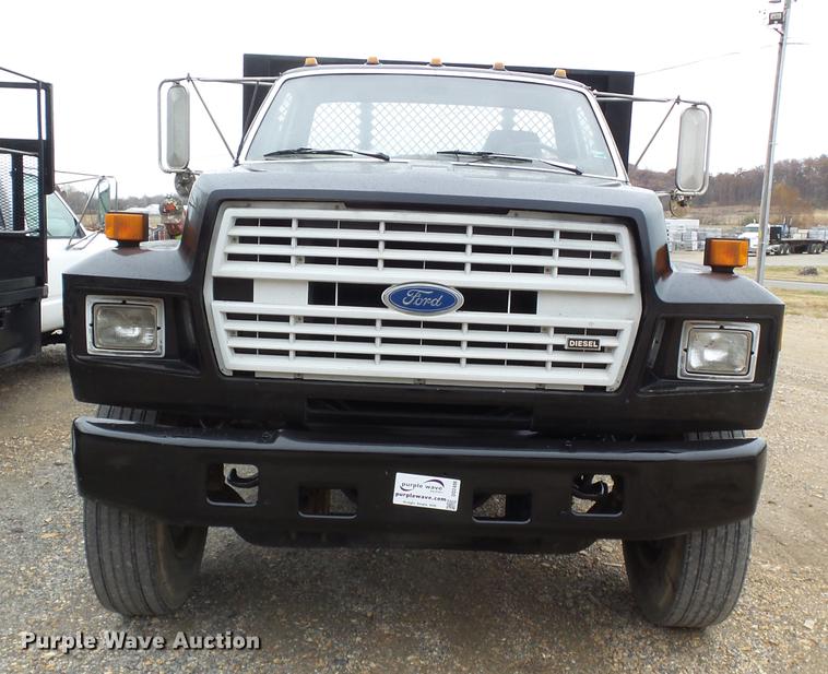 image for item DD2406 1990 Ford FT900 flatbed truck