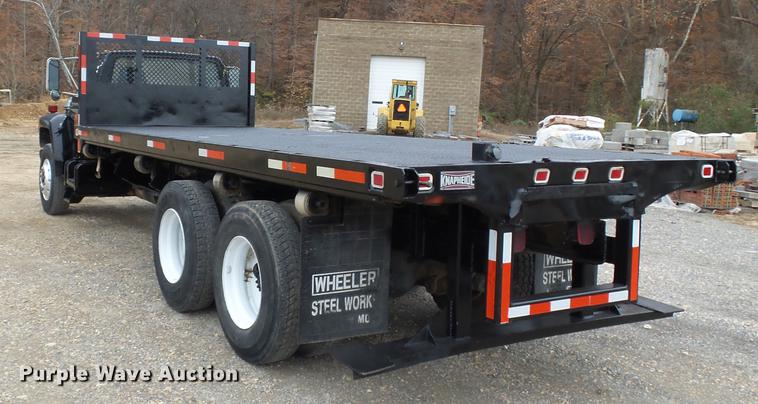 image for item DD2406 1990 Ford FT900 flatbed truck